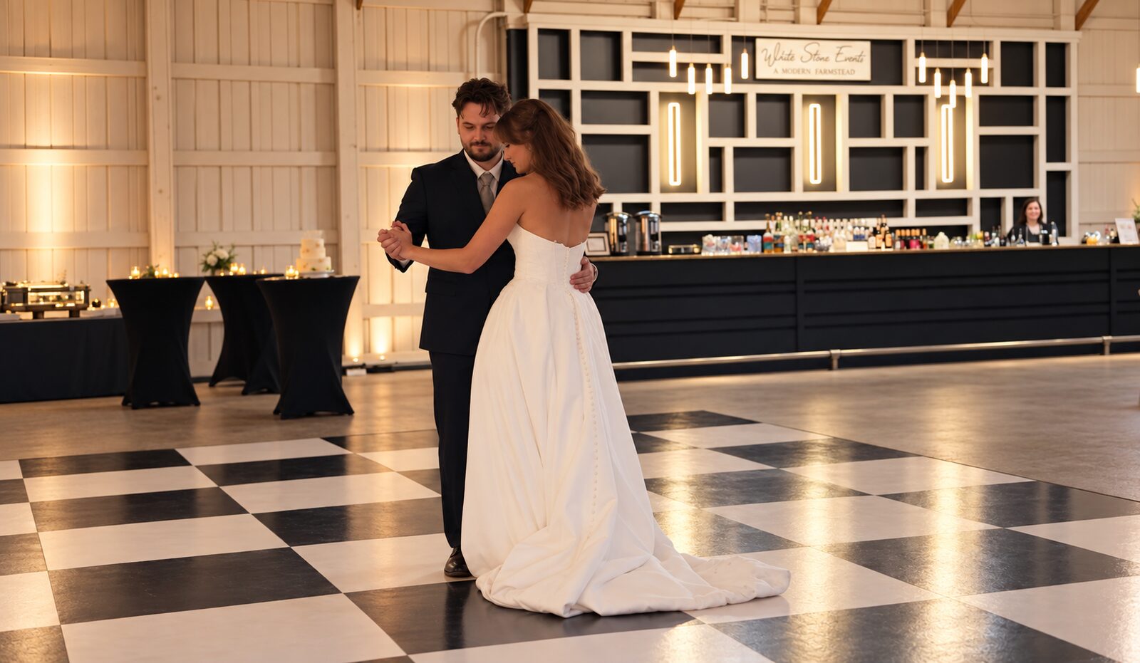 Couple’s first dance on a black-and-white checkered floor