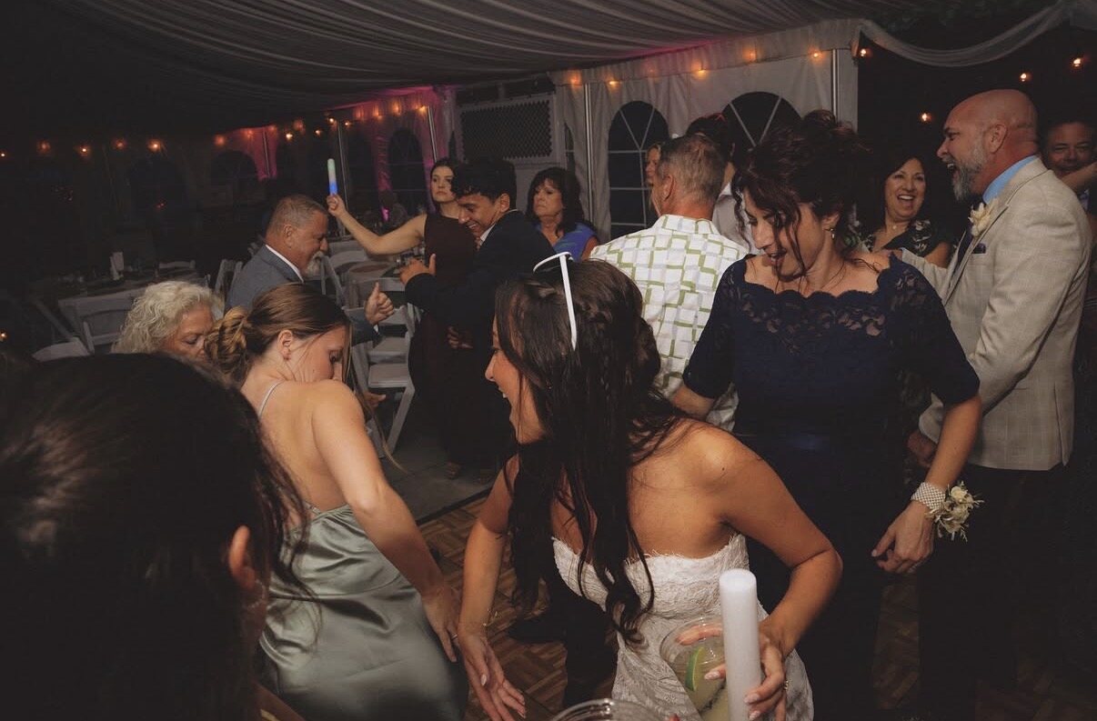 Jersey dancing with family and guests on the tent dance floor at Northfork Farm